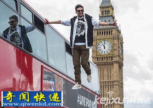英魔术师上演惊人绝技 凭空悬浮于大厦顶端引来无数粉丝围观